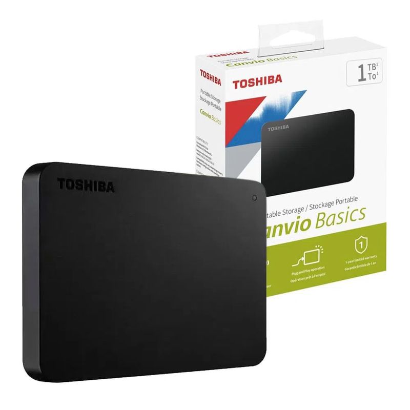 Disco duro externo Toshiba Canvio Basics de 1TB color negro presentado junto a su empaque original con detalles técnicos, logotipo de marca grabado y acabado mate resistente vista en perspectiva fondo blanco