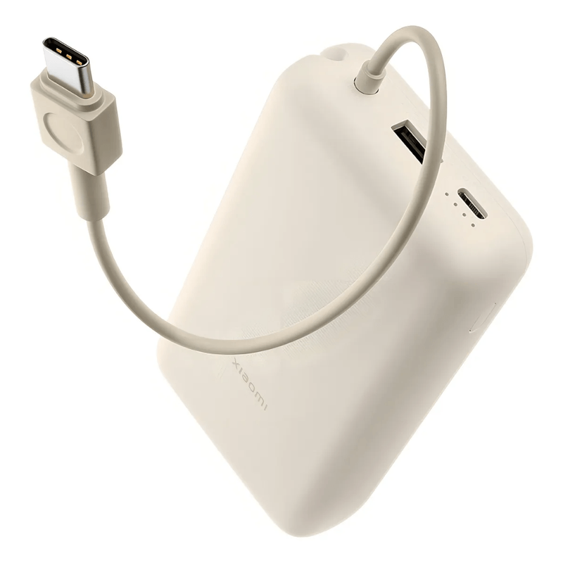 Power Bank Xiaomi 20000mAh 33W, carga rápida, hasta múltiples cargas, beige, ángulo frontal oblicuo con cable de carga